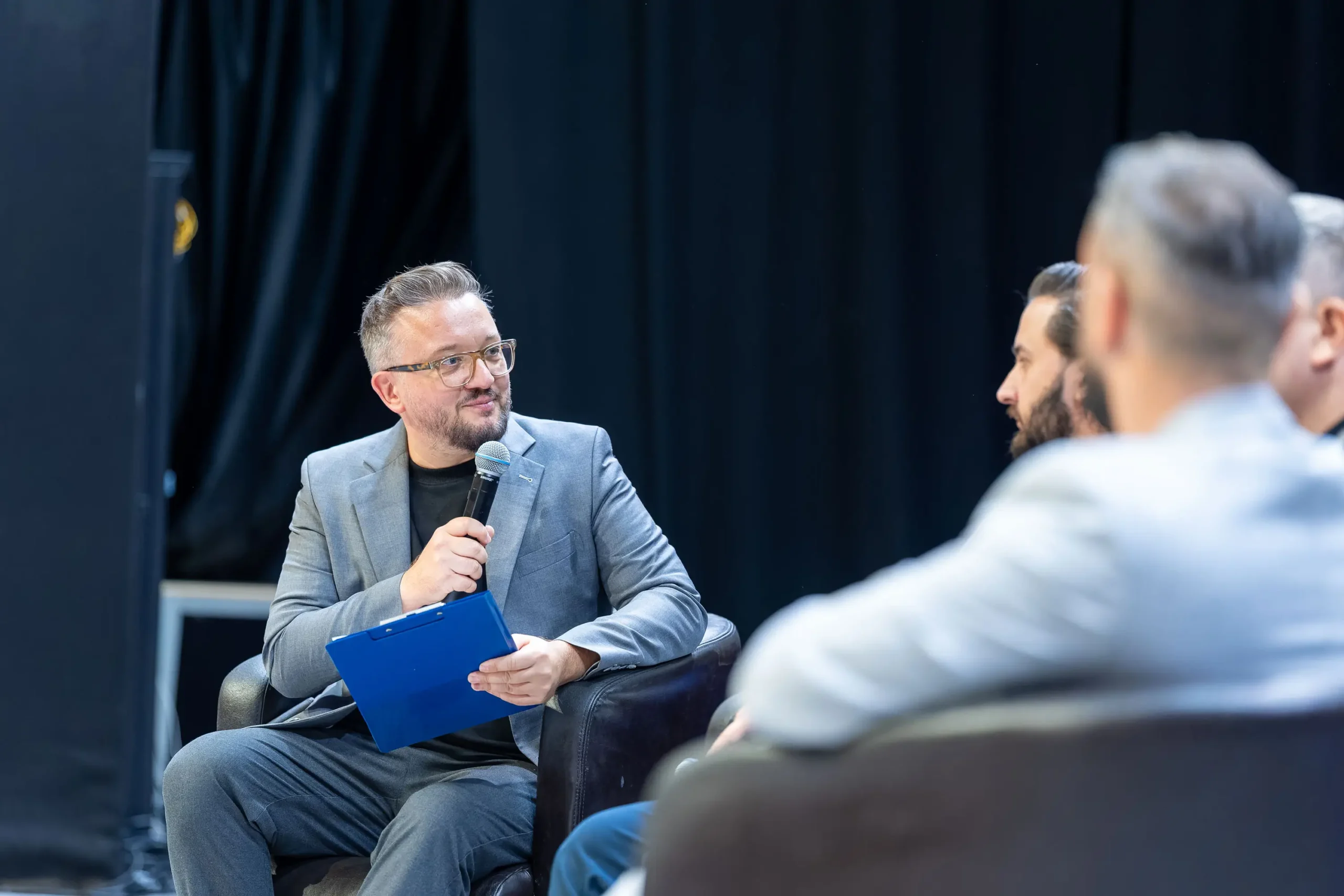Florin Grozea participating in a panel discussion at a business event
